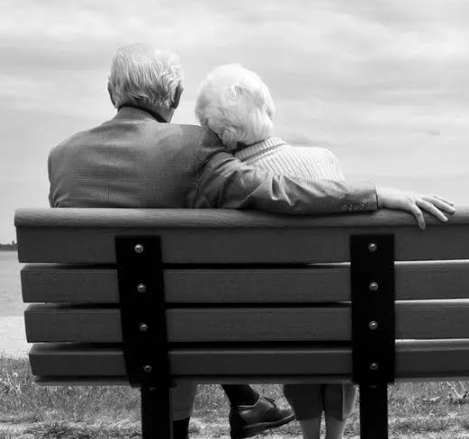 old couple on bench reverse mortgage.png